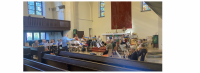 Der Dirigent, Komponist und Posaunist Matthias Jann begeistert Bläserinnen und Bläser aus dem Kirchenkreis Berlin Süd-Ost bei Wochenend-Workshop in Karlshorst. Foto: Jürgen Hahn